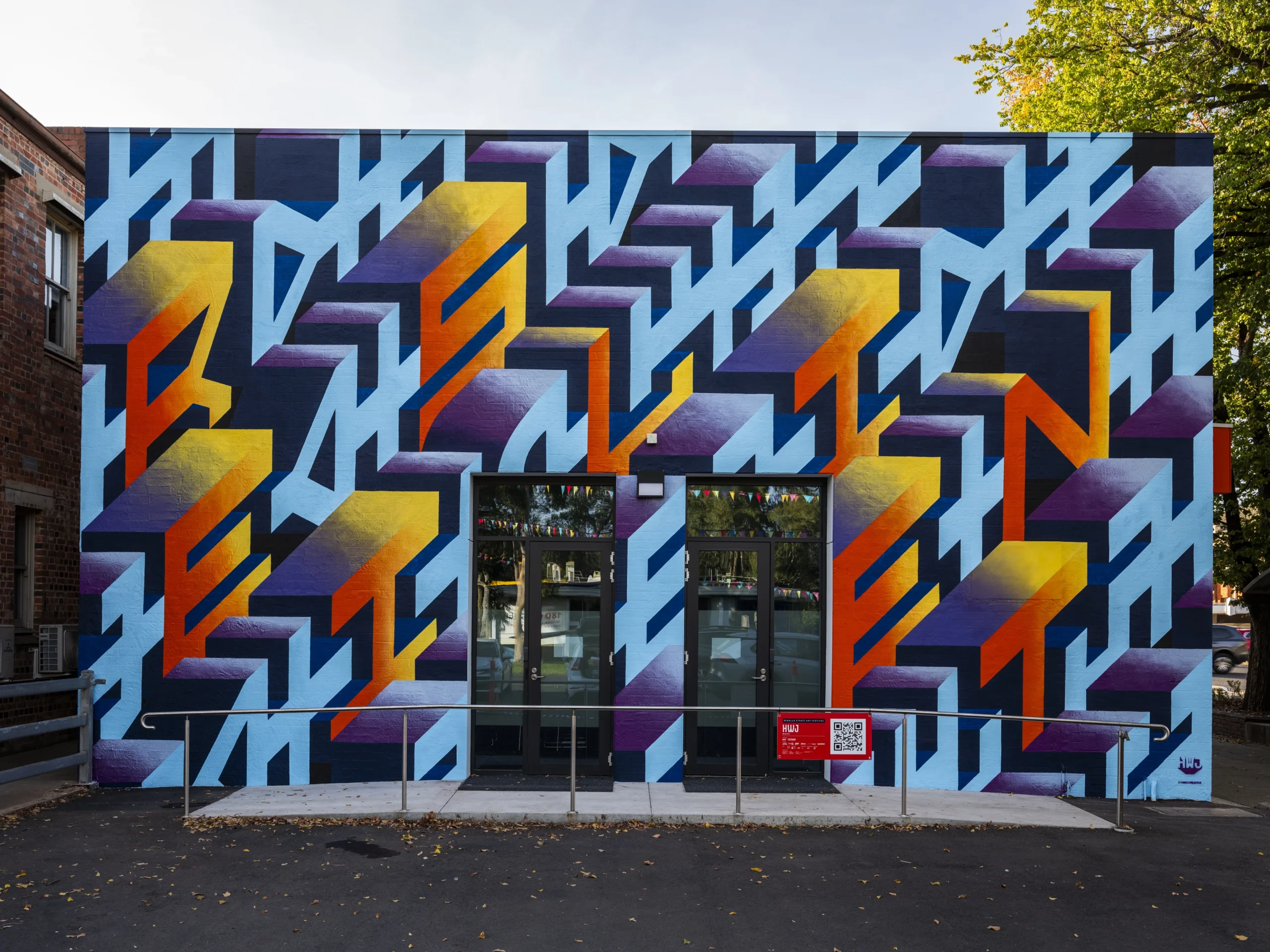 This artwork celebrates the resilience of country towns like Benalla. HWJ uses the word 'Resilient' to symbolize the strength needed to sustain rural communities. The colours reflect the stunning sunrises and sunsets often seen in the area. This artwork was part of the 2025 Benalla Street Art Festival.
